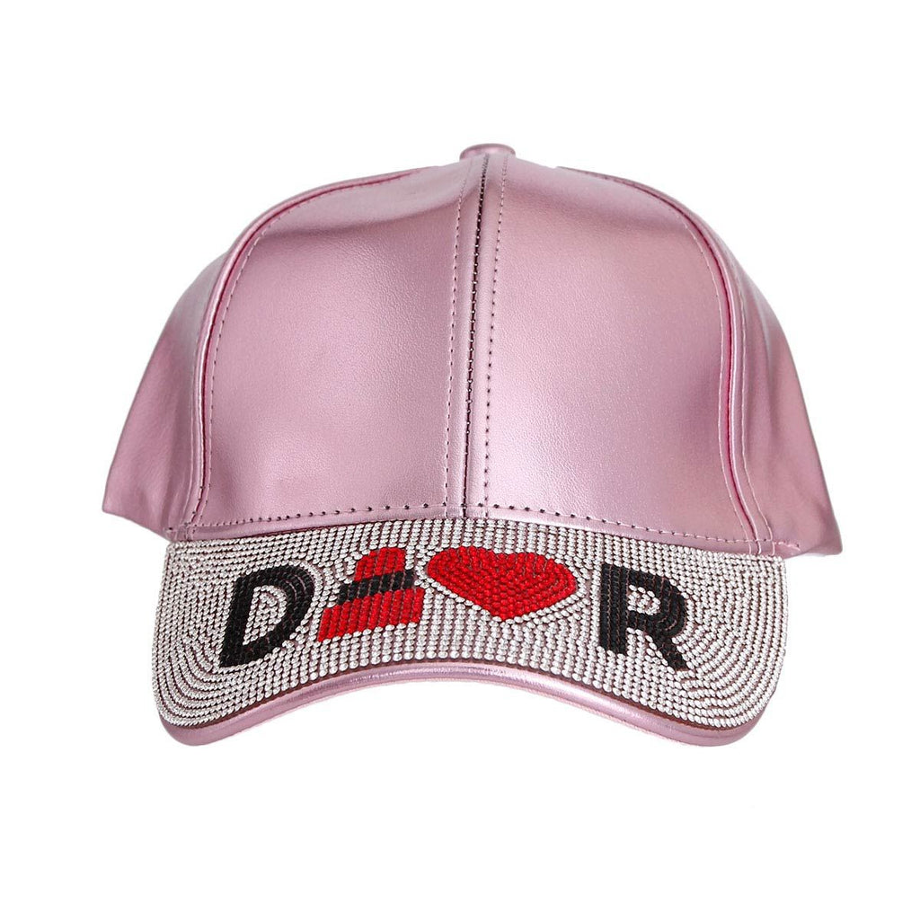 Metallic pink visor hat lipstick heart rhinestone detail close up designer
