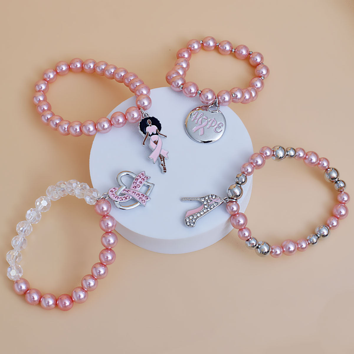 Light pink pearl hope breast cancer bracelet 4pc set on wrist