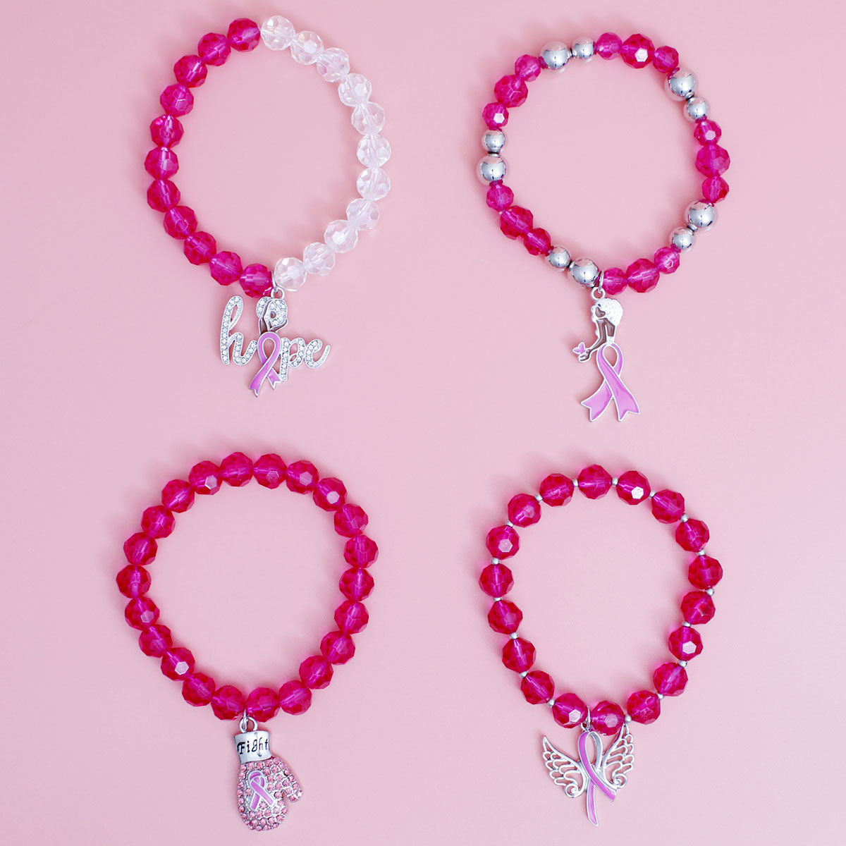 Pink glass bead breast cancer fight bracelet stacked on wrist