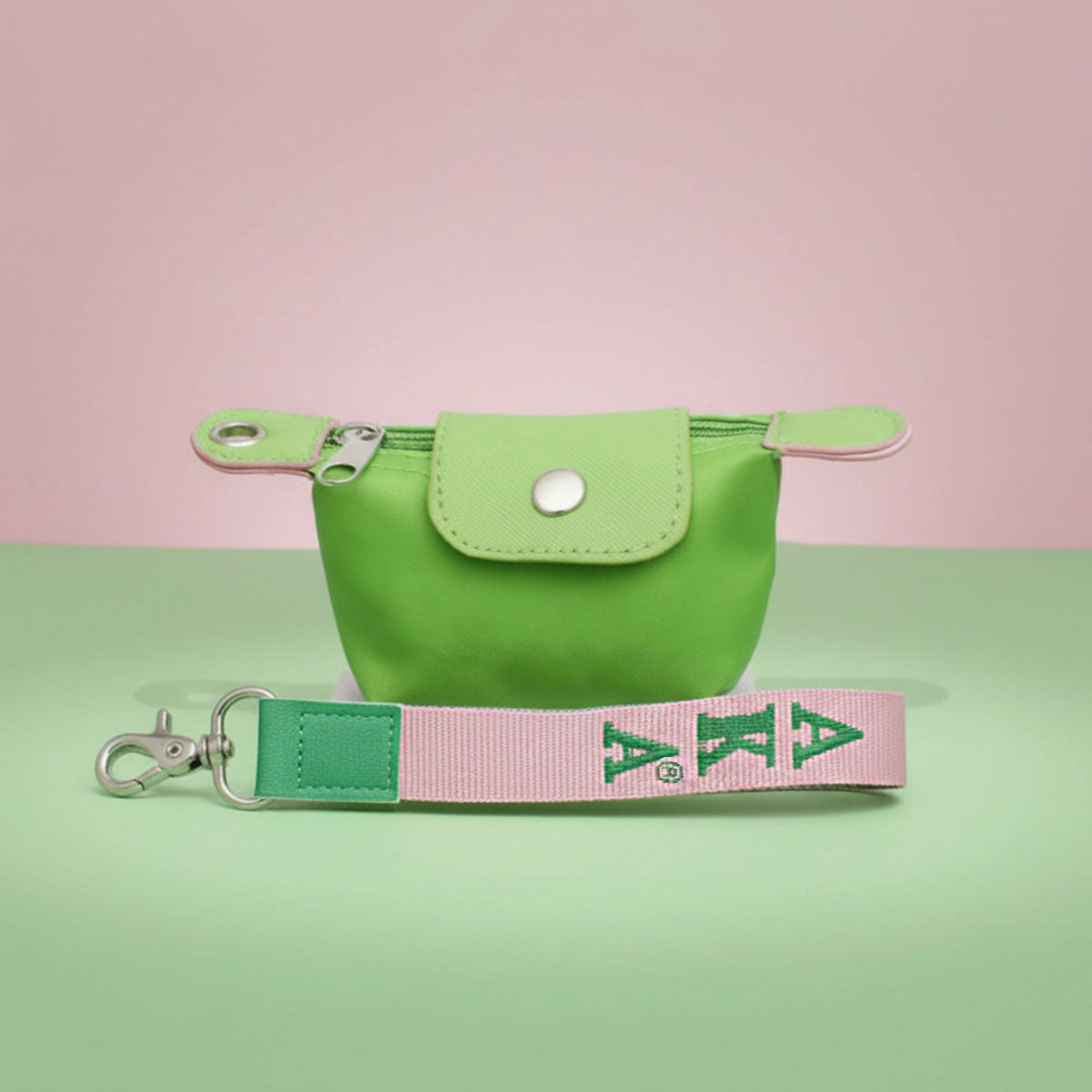 Green nylon wristlet mini pouch worn on wrist side view compact