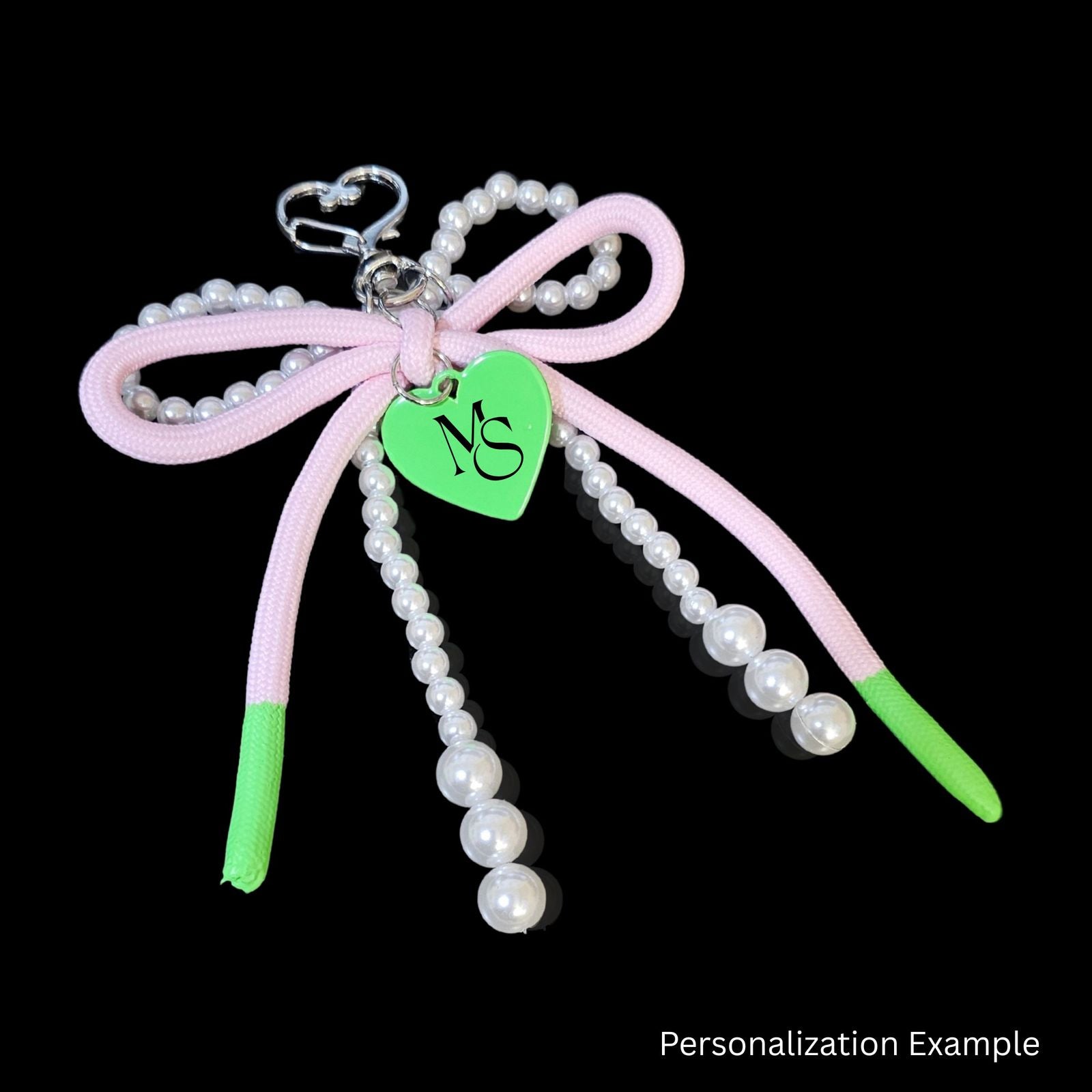 Pink green heart bag charm purse clip worn on handbag side view