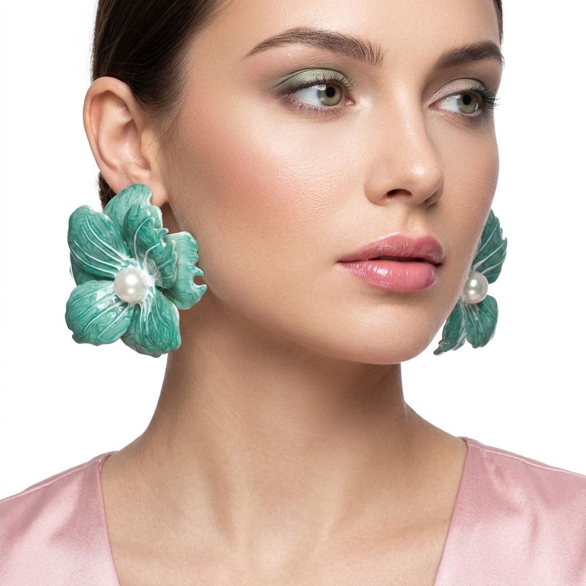 Green oversized painted flower studs worn on ear vibrant