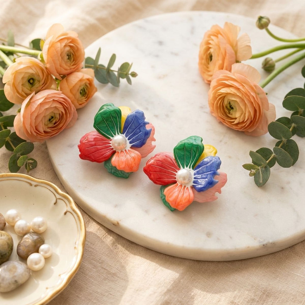Multicolor flower stud earrings swirled enamel petal detail close up