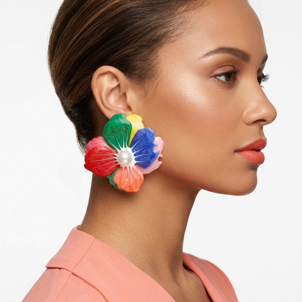 Multi oversized painted flower studs worn on ear vibrant color