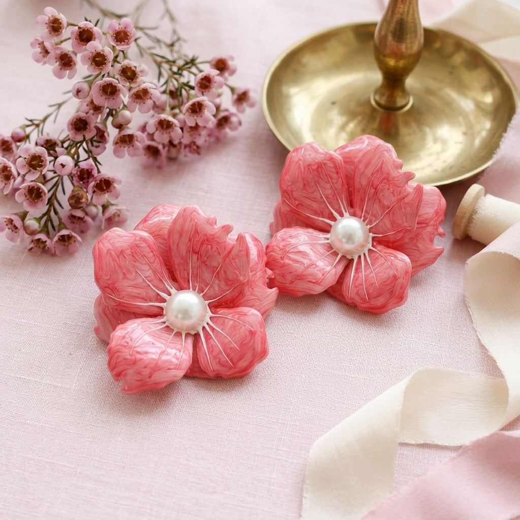 Dark pink oversized flower stud earrings enamel petal detail close up