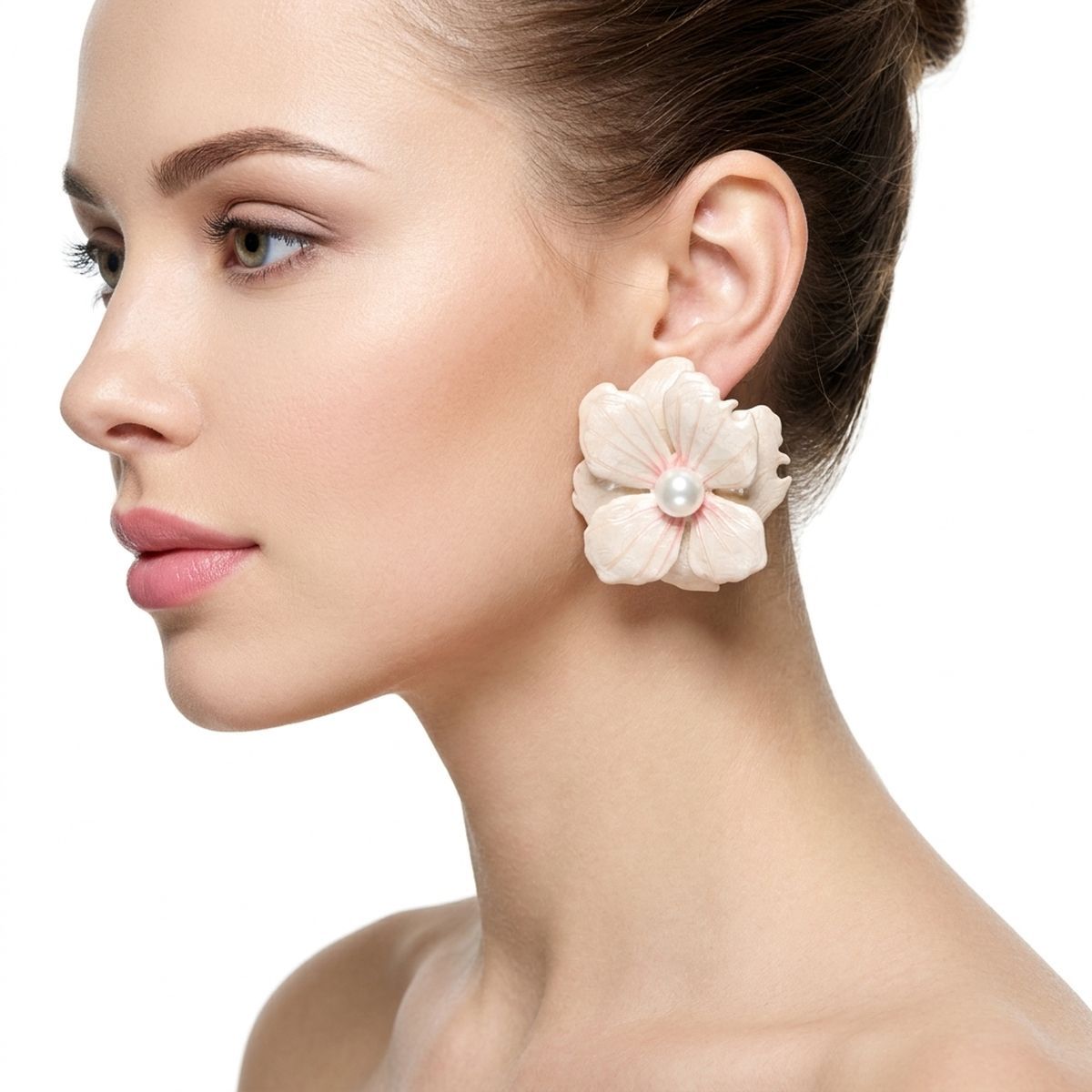 White painted flower stud earrings worn on ear tropical clean