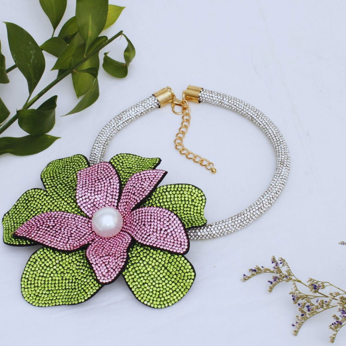 Pink green flower choker necklace worn on neck front view bold