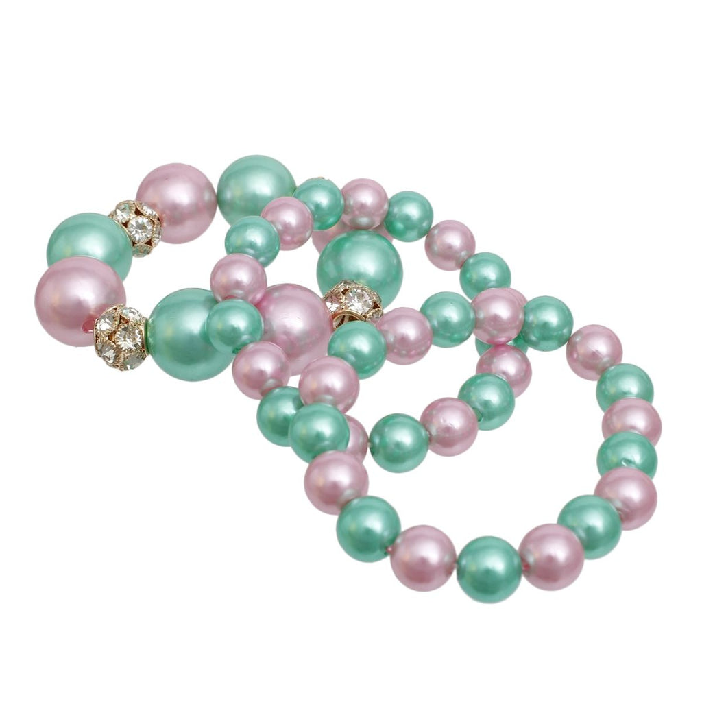 Pink green chunky pearl bracelet set 3pc stacked on wrist detail close up