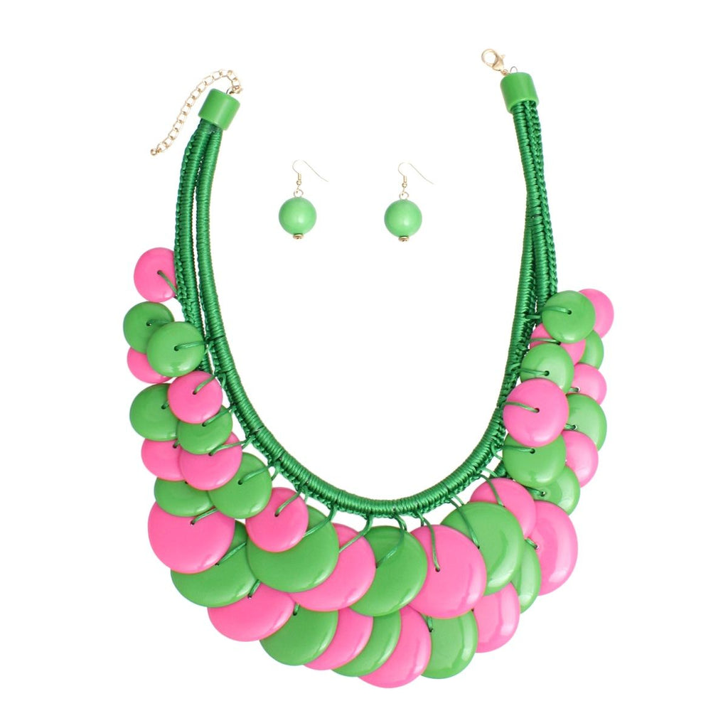Pink green long cord disc necklace chunky disc detail close up braided