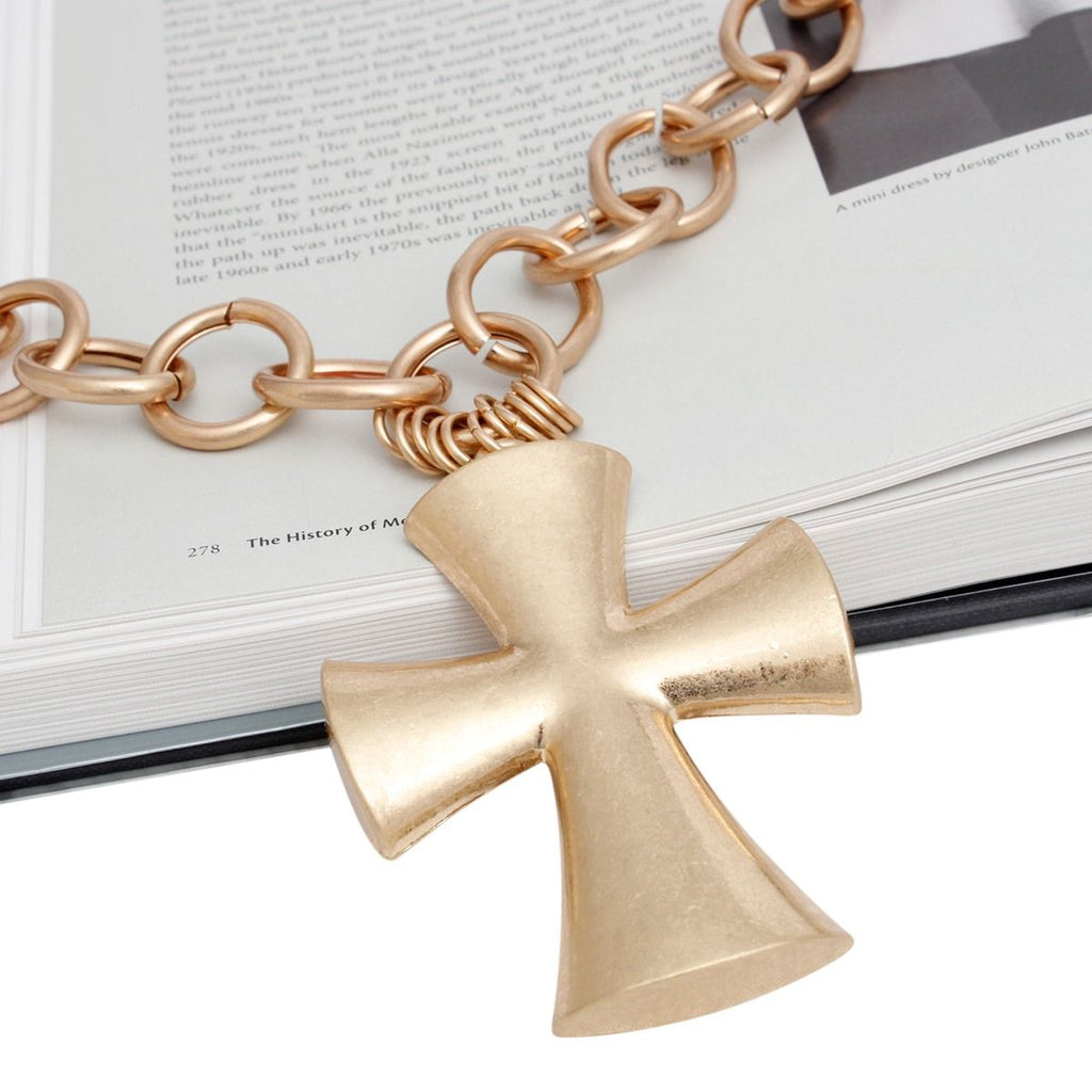 Chunky matte gold cross pendant necklace front view industrial luxe worn on neck