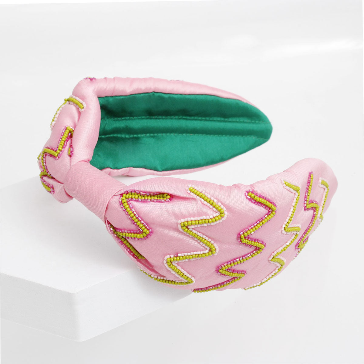 Pink green zig zag embroidered headband detail close up pattern texture